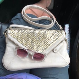 Kimchi Blue Ivory purse with bronze detailing.